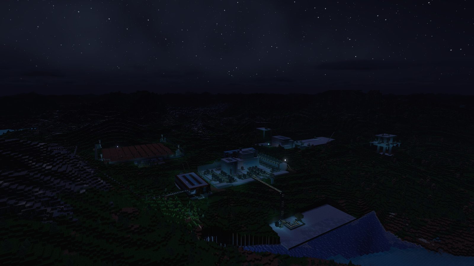 Starry night over hilly grass terrain with lit buildings, a farmed plot and connected pipe and conveyor runs
